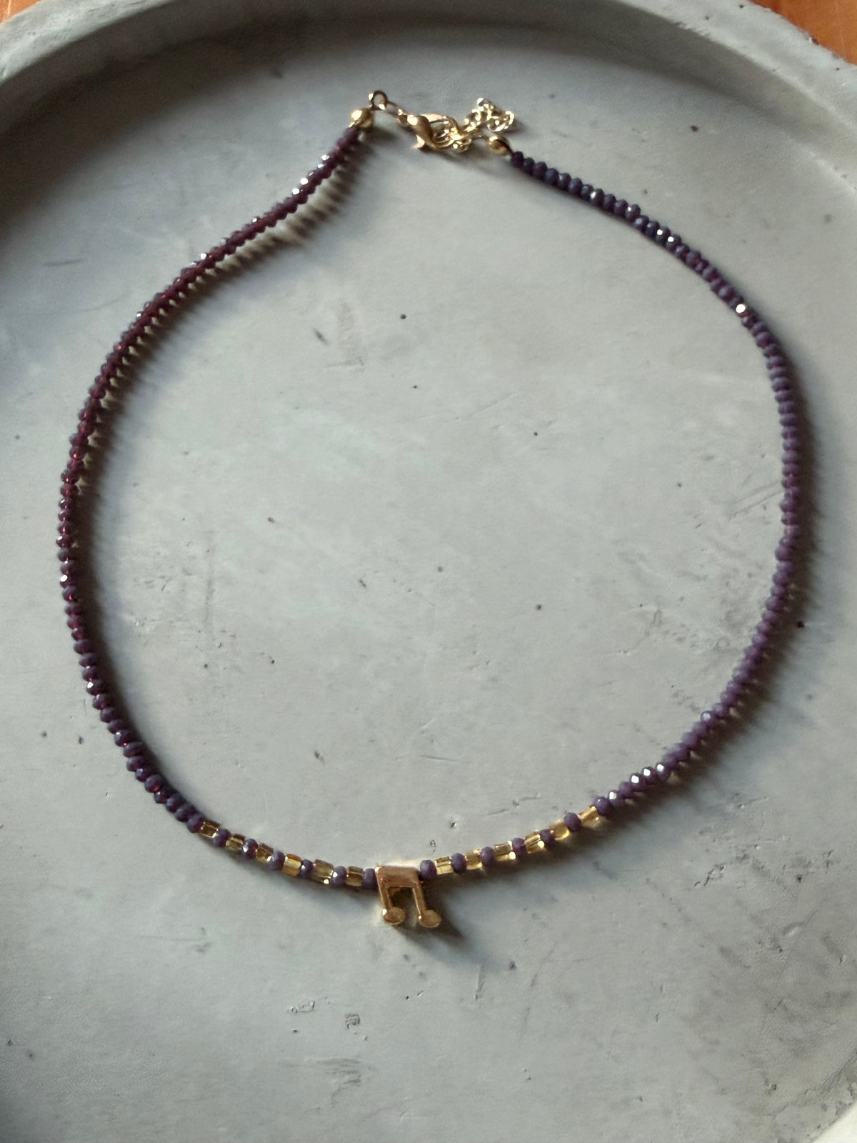Necklace with music note pendant